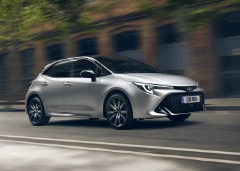 featured image is a used car, commonly hybrid/fuel , alluding to the title of the blog post. Silver car on road.