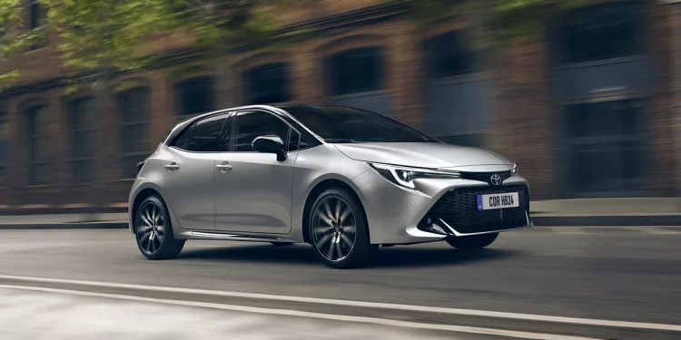 featured image is a used car, commonly hybrid/fuel , alluding to the title of the blog post. Silver car on road.